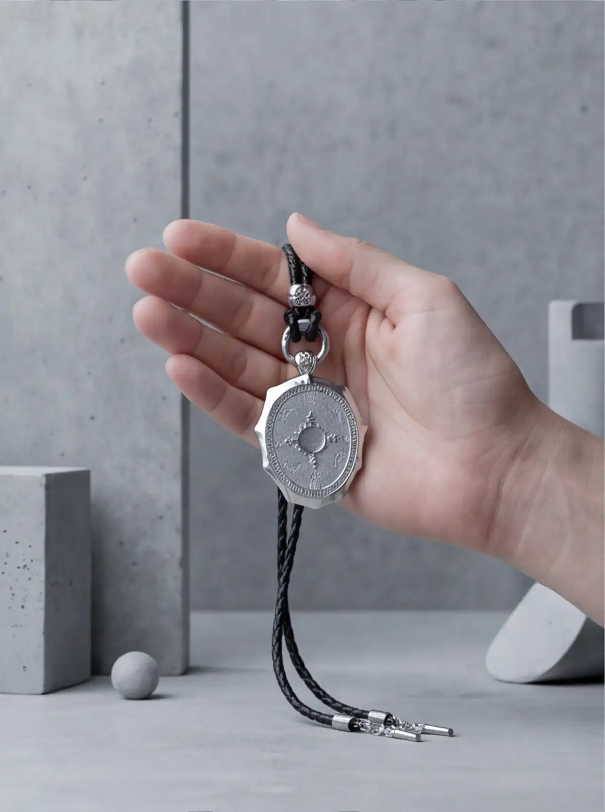 A hand-held scene helps communicate pendant scale.