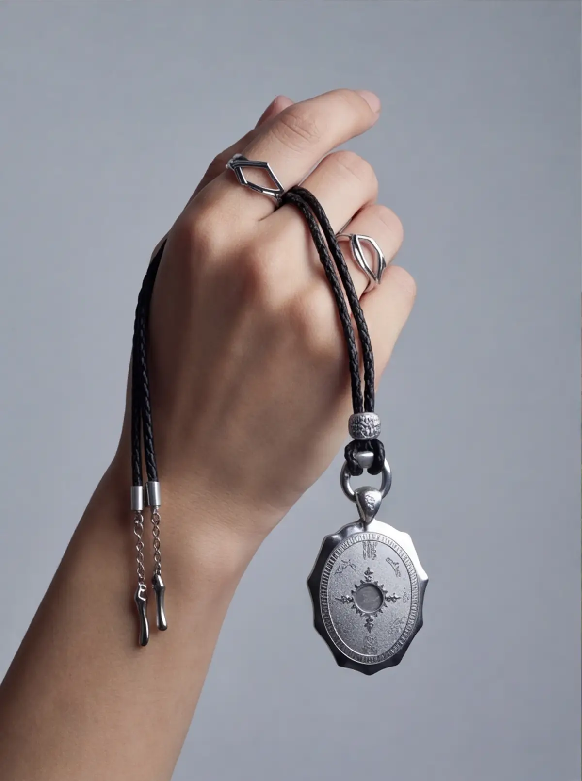 Wrist and cord drape reveal scale in use.