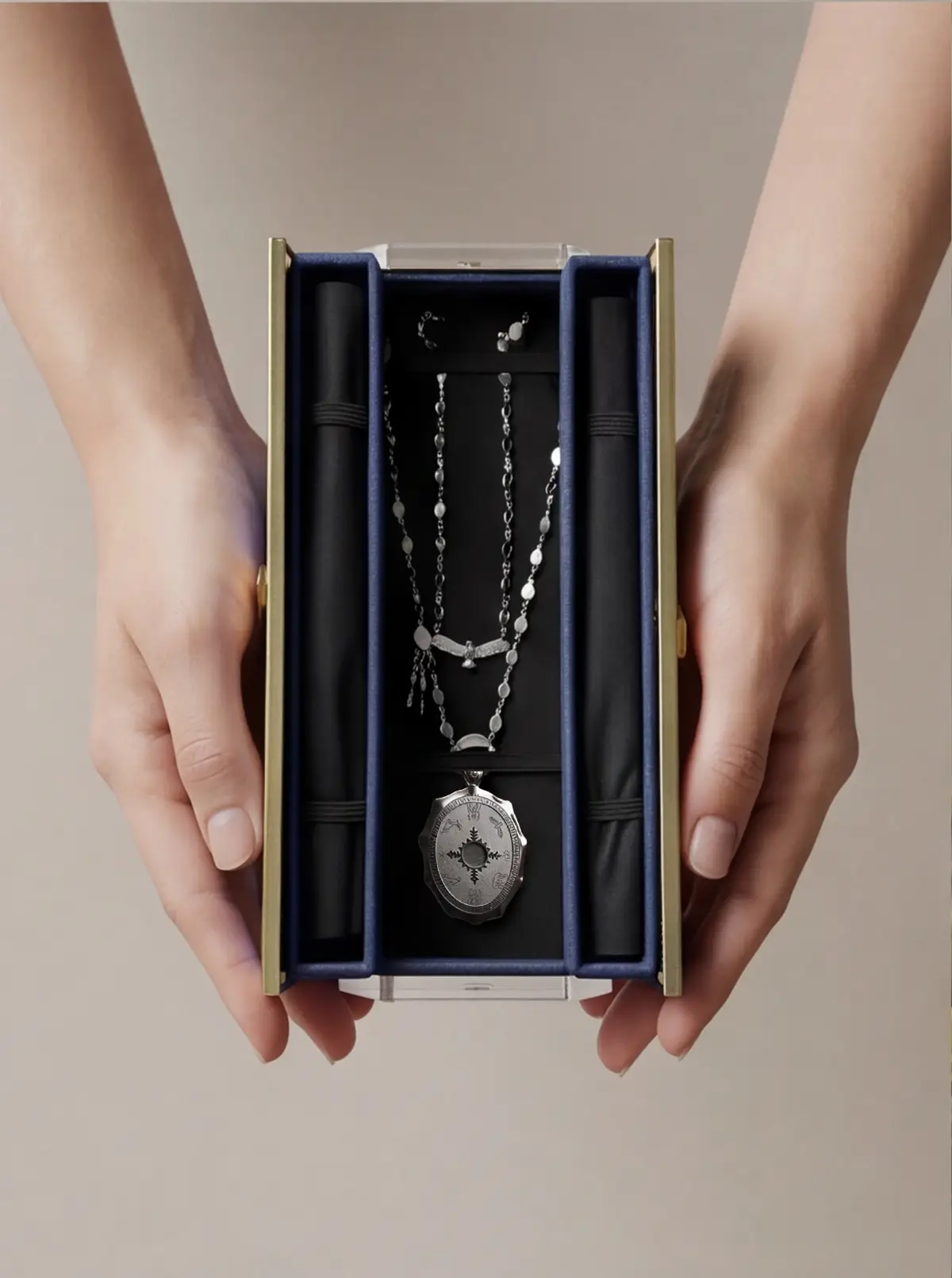 Hands holding the case underline the handover moment.